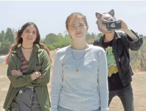  ?? THE ORCHARD ?? Maya Eshet, Zoey Deutch and Dylan Gelula check their work in "Flower."