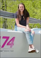  ?? SARAH GORDON/THE DAY ?? Marine Science Magnet High School senior Lily Flack with a sailboat May 21, behind her home in Stonington. Visit theday.com to see a video of an interview with her.