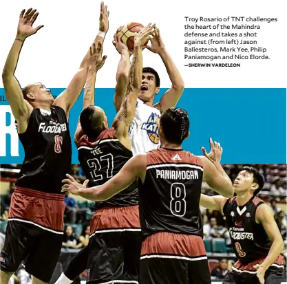  ?? —SHERWIN VARDELEON ?? Troy Rosario of TNT challenges the heart of the Mahindra defense and takes a shot against (from left) Jason Ballestero­s, Mark Yee, Philip Paniamogan and Nico Elorde.