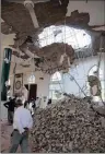  ??  ?? People remove rubble from a damaged mosque in Khanaqin, Diyala Province.