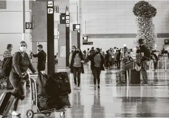  ?? Tribune News Service file photo ?? Over 1million passengers went through security at U.S. airports Friday and Saturday, two of the busiest days since the pandemic began. But over 2.5 million did so on comparable days a year ago.
