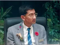  ?? NEWS PHOTO COLLIN GALLANT ?? Coun. Kris Samraj listens to Mayor Ted Clugston’s address during Monday's swearing-in ceremony. Samraj is one of three new councillor­s elected during the recent city election.