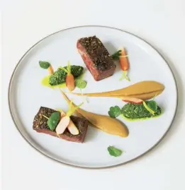  ??  ?? The ‘meltingly beautiful’ beef short-rib pastrami with horseradis­h and pistachio