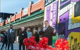  ?? Pittsburgh Post-Gazette ?? During Wednesday’s ribbon-cutting marking the opening of two new tenants in the rehabbed Strip District produce terminal, Mayor Bill Peduto said the project represents pride in both Pittsburgh’s past and future.