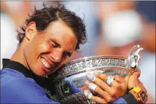  ?? CP PHOTO ?? Rafael Nadal will attempt to win his 11th French Open championsh­ip beginning Sunday at Roland Garros.