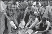  ??  ?? GJM supporters burn copies of the GTA accord during a protest in Dagapur village on outskirts of Siliguri on Tuesday.