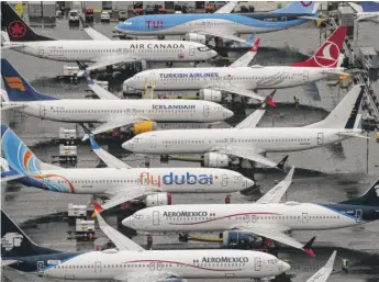  ?? DAVID RYDER/ GETTY IMAGES ?? Boeing 737 Max airplanes are parked at the company’s production facility this month in Renton, Washington.