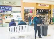  ??  ?? Security officer Don Howell patrols the Shenango Valley Mall. He has tried to get businesses to fill the vacancies.