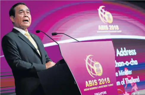  ?? EPA ?? Prime Minister Prayut Chan-o-cha delivers his speech during the Asean Business and Investment Summit on the sidelines of the 33rd Asean Summit and Related Meetings in Singapore yesterday.