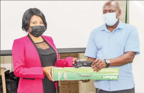  ??  ?? Advisor to the Minister of Education, Africo Selman (left) handing over some of the items to the Principal of the Guyana Industrial Training Centre, Dexter Cornette (Ministry of Education photo)