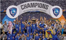  ?? Photograph: AFP/Getty Images ?? Al-Hilal celebrate winning the 2021 AFC Champions League final. They are now owned by PIF, along with two other clubs in the 2023 tournament.