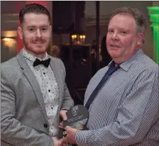  ??  ?? Chairman Laurence Ellis presents Philip Murphy with the award for Intermedia­te Player of the Year.