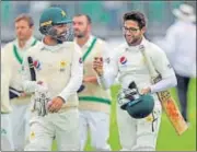  ?? AP ?? Shadab Khan and Imamulhaq (right) celebrate victory.