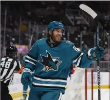  ?? NHAT V. MEYER — BAY AREA NEWS GROUP ?? The Sharks' Mike Hoffman (68) celebrates his goal against the Blues in the first period at SAP Center in San Jose on Thursday.