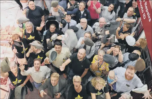  ?? PICTURE: SIMON HULME. ?? HATS OFF: Above and inset below left, people take part in the ‘most people to wear a flat cap’ event to mark Yorkshire Day at Kirkgate Market, Leeds.