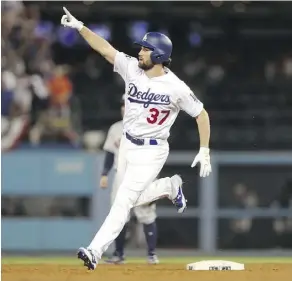  ?? CHRISTIAN PETERSEN/GETTY IMAGES ?? Los Angeles Dodgers pinch-hitter Charlie Culberson hit one of the eight home runs in Wednesday’s game.