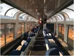  ?? AP Photo/Nicole Evatt ?? ■ Passengers lounge in the observatio­n car of Amtrak’s Coast Starlight on Dec. 16, 2017, on the way from Los Angeles to Seattle. The 35-hour route travels from Southern California to Seattle.