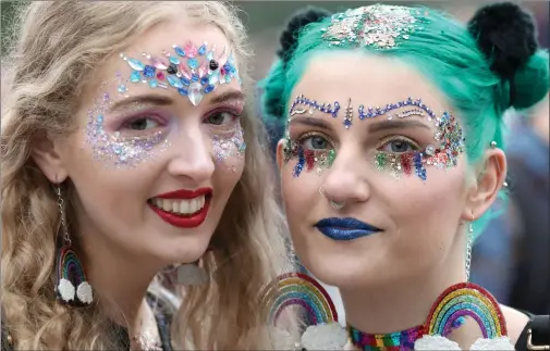  ??  ?? A pair of revellers put a colourful face on it as thousands descended on Glasgow Green for the first outing in the city of the TRNSMT festival.