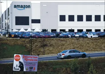  ?? JAY REEVES — THE ASSOCIATED PRESS ARCHIVES ?? Amazon employees in Bessemer, Alabama, finished their vote to unionize on Monday. The union push could spread to other parts of Amazon and threaten the company’s profits, which soared 84% last year to $21 billion.