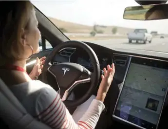  ?? BECK DIEFENBACH/REUTERS ?? New autopilot features installed in some 40,000 Tesla vehicles have given drivers some dangerous new habits.