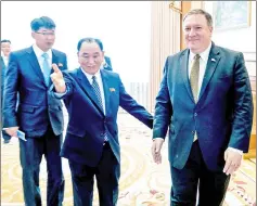  ??  ?? Pompeo (right) and Kim arrive for a lunch at the Park Hwa Guest House in Pyongyang. — AFP photo