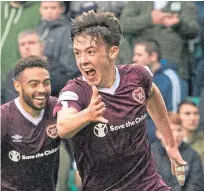  ??  ?? Aaron Hickey celebrates his goal against Hibs.