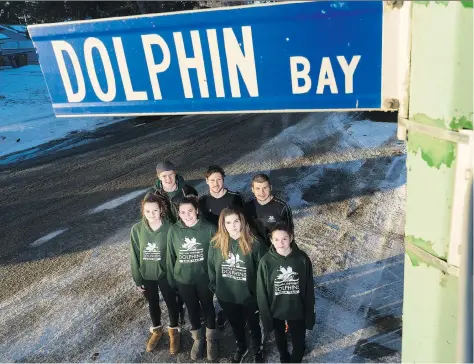  ?? MICHAEL BELL ?? Seven members of the Regina Optimist Dolphins Swim Club live on Dolphin Bay, appropriat­ely enough, not to mention president Nannette Chaboter, too. The swimmers who live on Dophin Bay include, from left in the front row, Olena Rashovich, Emily...