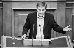  ??  ?? Greek Finance Minister Tsakalotos delivers a speech during a parliament­ary session before a budget vote in Athens, Greece. Tsakalotos says Greece is open to extending a contingenc­y mechanism to ensure it will meet fiscal targets beyond 2018 to break a stalemate in talks with its eurozone lenders and the IMF over its second bailout review. — Reuters photo