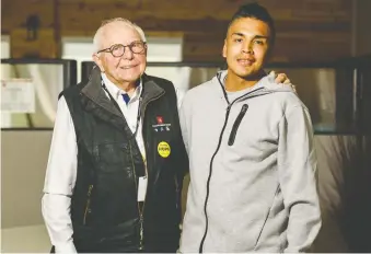  ??  ?? Jim Moore, Calgary Dream Centre CEO and executive director, is looked on as a father figure by residents, like 23-year-old Lansin Goodrunnin­g, who has reconnecte­d with his son since getting sober.