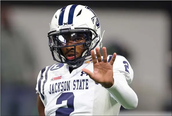  ?? KEVIN C. COX — GETTY IMAGES ?? Shedeur Sanders warms up prior to Jackson State playing in the Celebratio­n Bowl against North Carolina Central on Dec. 17 at Mercedes- Benz Stadium in Atlanta.