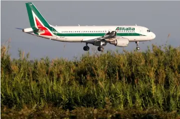  ??  ?? An Alitalia Airbus A320-200 airplane approaches to land at Fiumicino airport in Rome, Italy. – Reuters photo