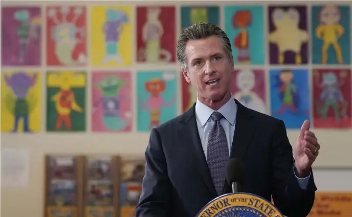  ?? AP ?? OUT IN FRONT: California Gov. Gavin Newsom speaks Friday at a San Francisco middle school. Newsom is readying for the first statewide vaccine mandate for schoolchil­dren in the country.