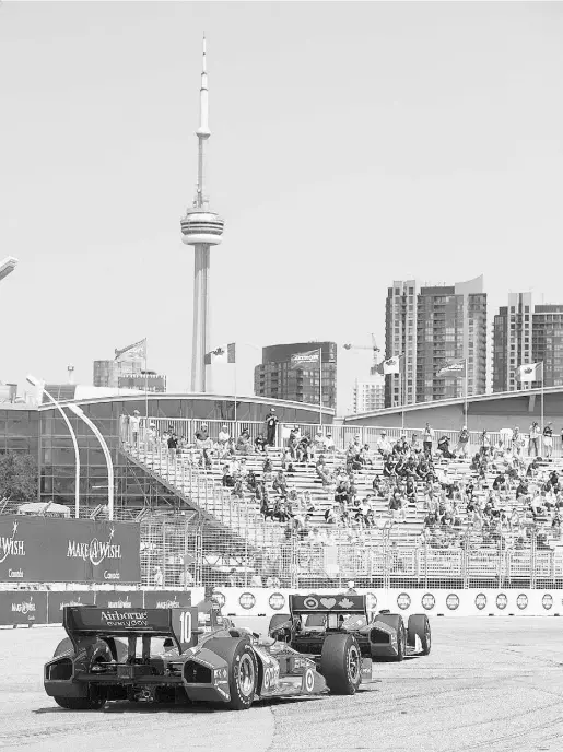  ?? Laura Pedersen / National Post ?? Exhibition Place route is one of IndyCar’s temporary circuit courses, where Toronto Indy drivers get to zip around on the roads that locals are more familiar with being pure gridlock during rush hour the other 51 weeks of the year.