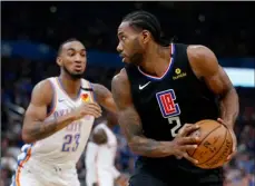  ?? AP PHOTO /GARET FISBECK ?? Los Angeles Clipper’s Kawhi Leonard (2) goes against Oklahoma City Thunder’s Terrance Ferguson (23) during the first half of an NBA basketball game in Oklahoma City, on Tuesday.