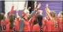  ?? Matthew Brown / Hearst Connecticu­t Media ?? New Canaan coach Kevin Marino joins with his girls as they prepare for a girls volleyball match against Westhill at Westhill High School in Stamford in 2019.