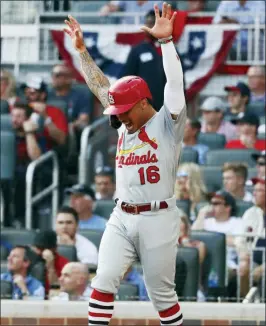  ?? JOHN BAZEMORE — THE ASSOCIATED PRESS ?? St. Louis’ Kolten Wong celebrates after scoring on a wild pitch by Atlanta’s Max Fried during the first inning of Game 5 on Wednesday.