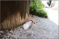  ?? Michael Cummo / Hearst Connecticu­t Media ?? An empty “nip” bottle lays discarded on a Stamford street in 2016.