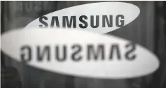  ??  ?? The logo of Samsung Electronic­s is seen at its office building in Seoul, South Korea. Samsung estimated on Friday earnings grew at the slowest pace in more than a year in the second quarter, as analysts said weak smartphone sales likely offset record...