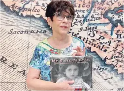  ??  ?? Joan Arnay Halperin displays a copy of her book, ‘My Sister’s Eyes’. Her eldest sister, who was a Polish refugee at Gibraltar Camp in St Andrew, died in Jamaica and was buried in the Jewish cemetery on Orange Street, downtown Kingston.