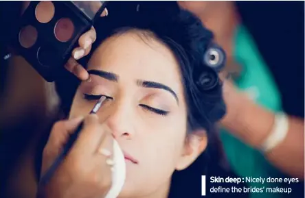  ??  ?? MEDHAVI & DHAVAL KOTECHA Skin deep : Nicely done eyes define the brides’ makeup