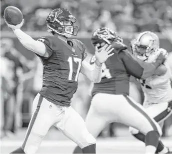  ?? Brett Coomer / Houston Chronicle ?? Texans quarterbac­k Brock Osweiler throws a pass against the Saints during the first quarter Saturday night. Osweiler was 12-for-19 for 124 yards and a touchdown in the Texans’ 16-9 victory.