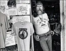  ?? AJC FILE ?? Dent “Wildman” Myers is pictured in 1990 at his Civil War relic and Confederat­e memorabili­a store in Kennesaw. Myers operated the store for more than 50 years.