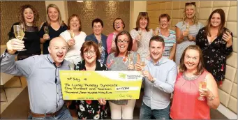  ?? Photo by Mac Innes Photograph­y. ?? The ‘Lucky Thursday Syndicate’ from Herlihy’s Centra in Fermoy celebratin­g with a glass of bubbly after picking up their winning cheque at Lotto HQ in Dublin.