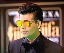  ??  ?? In this file photo, Bollywood film maker Karan Johar poses for photograph­ers at the Internatio­nal Indian Film Academy (IIFA) Rocks Green Carpet for the 17th Edition of IIFA Weekend and Awards in Madrid, Spain. — AP