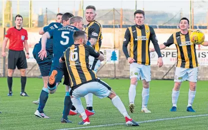  ?? Pictures: SNS Group. ?? Above: Partick’s Steven Anderson gets in front of Craig Watson to score the only goal of the tie in the second half from Craig Slater’s delivery; below: Darren Young, left thinking what might have been after losing disappoint­ing goal.
