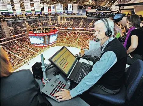  ?? LES BAZSO ?? Former Canucks announcer John Ashbridge, seen looking down onto the ice from his fifth-floor perch at Rogers Arena in 2011, has died at 71.