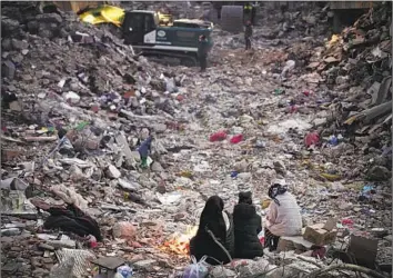  ?? Francisco Seco Associated Press ?? RESIDENTS of Antakya in southern Turkey watch Feb. 15 as a rescue team searches for their relatives among debris. The U.N. says hundreds of thousands of people still have “extensive humanitari­an needs.”