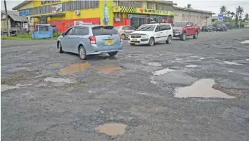  ??  ?? Potholes on the road along Kasanji Street and Jai Hanuman Street in Vatuwaqa.