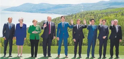  ?? AFP/Getty Images ?? Government leaders gather in Quebec on Friday. They are, from left, European Council President Donald Tusk, British Prime Minister Theresa May, German Chancellor Angela Merkel, U.S. President Donald Trump, Canadian Prime Minister Justin Trudeau, French...