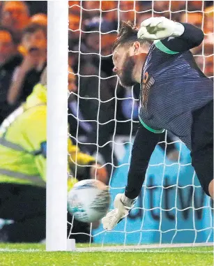  ??  ?? Penalty drama: Dean Gerken (main) saves from Christian Eriksen; Tom Lapslie (below left) scores the winner; Davinson Sanchez (below right) consoles Lucas Moura after his miss